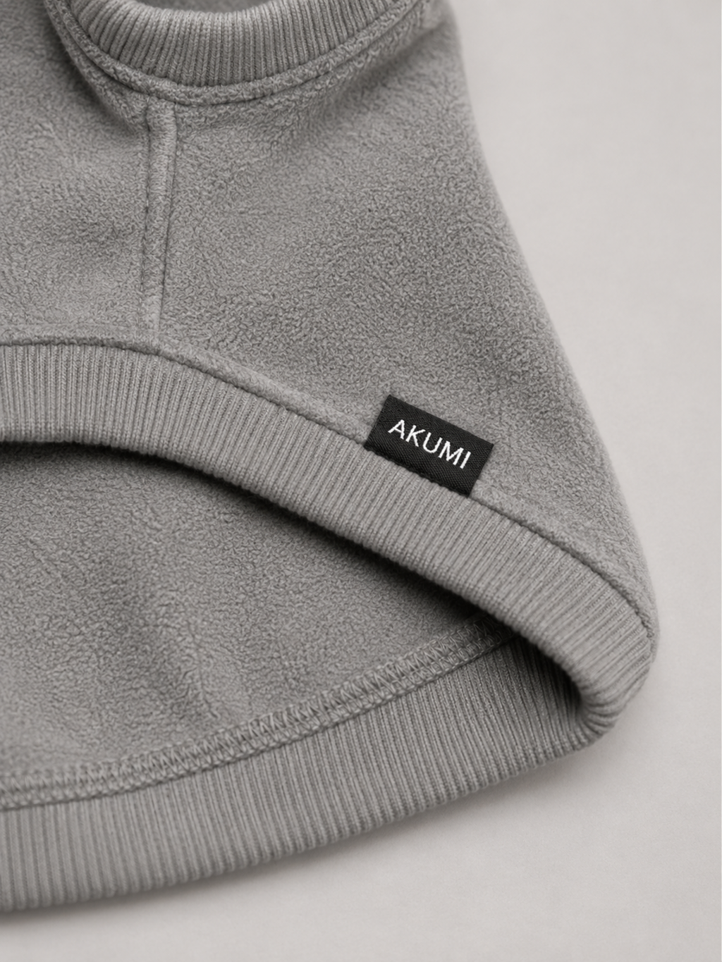 Stillform Pet Hoodie fleece, rib trim, and Akumi label detail