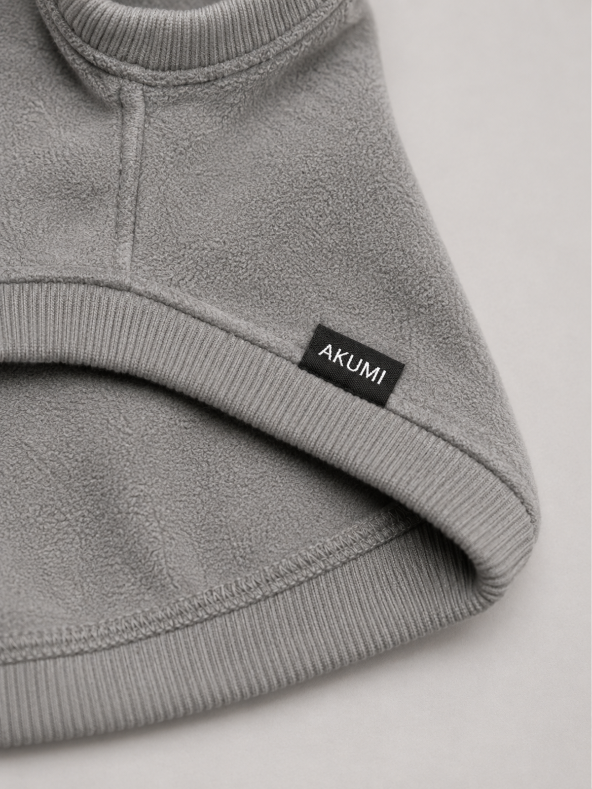 Stillform Pet Hoodie fleece, rib trim, and Akumi label detail