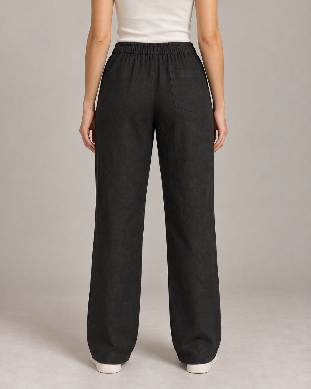 Generated design concept: Akumi Women's Coast Drawcord Woven Pant in Onyx, back studio view. Proposed construction, not a verified product photograph.