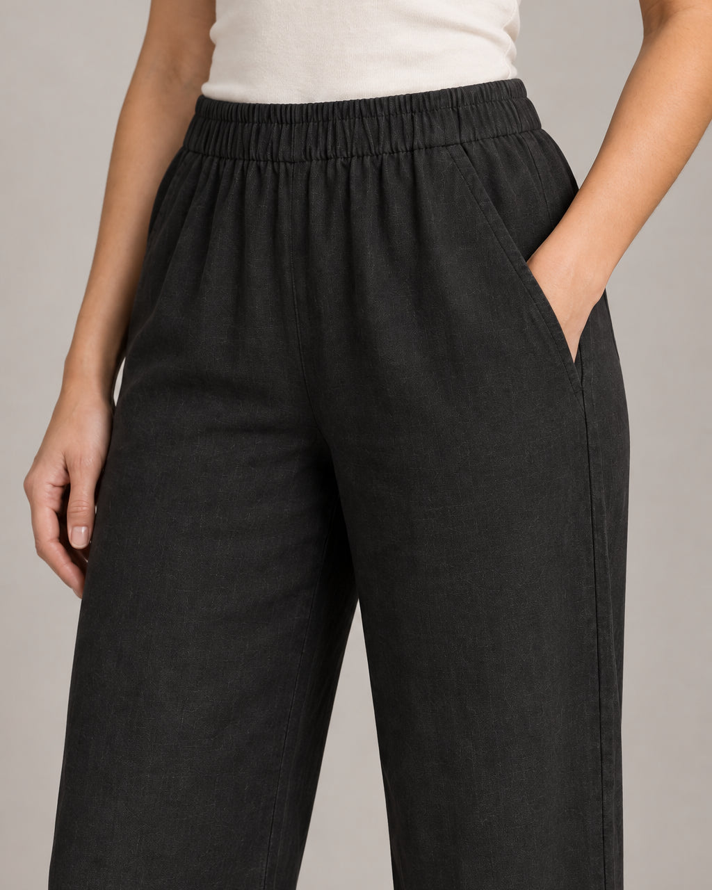 Generated design concept: Akumi Women's Coast Drawcord Woven Pant in Onyx, elastic waist and angled pocket detail. Proposed construction, not a verified product photograph.